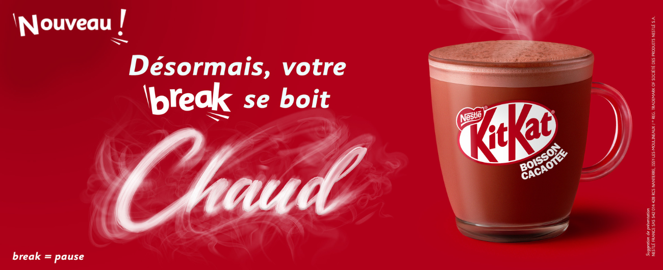 French ad for Nestlé KitKat hot cocoa drink, showing a steaming cup and text meaning "Now, your break is drunk hot."