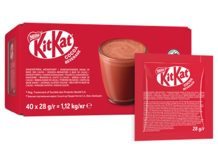 A red KitKat cocoa beverage box featuring a glass of chocolate drink and a single serving pouch, highlighting a sweet indulge
