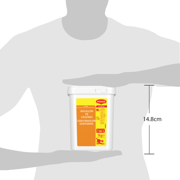 A person holding a 1 kg container of Maggi vegetable bouillon, labeled in French, with a white lid and orange design.