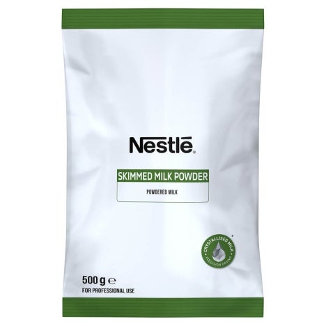 White bag of Nestlé Skimmed Milk Powder, 500g, labeled for professional use, with green accents and purity seal.