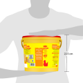 A yellow bucket of chicken bouillon with a red lid, held by a person, displaying nutritional information and measurements