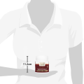 Container of Chef signature red wine and port reduction sauce held by a person, measuring 11.2 cm in height.